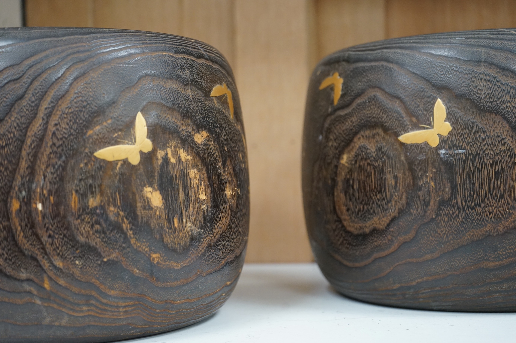 A pair of Japanese hibachi bowls with lacquered decoration and abalone inlay, label to the bases, 29cm in diameter. Condition - fair, some inlay missing